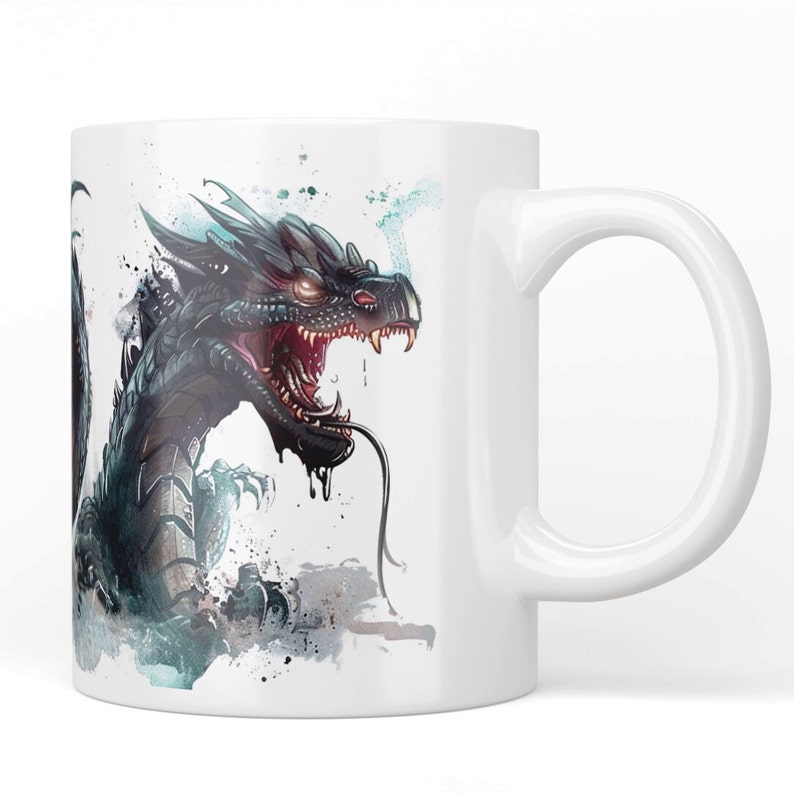 May include: White ceramic mug featuring a detailed illustration of a black dragon with red eyes and an open mouth. The dragon has sharp teeth and a long tongue. The design includes teal and gray watercolor-style accents.
