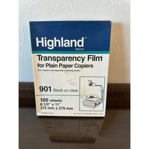 May include: A box of Highland brand transparency film for plain paper copiers. The box is primarily white with a dark blue top and features the text "901 Black on clear" and dimensions of 8 1/2" x 11".