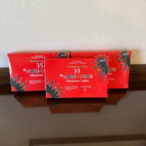 May include: Three rectangular red boxes of Professional Series 35 multi-color miniature lights. Each box features text stating Indoor String to String, 35 Multi-Color Miniature Lights, and includes illustrations of small colored light bulbs.