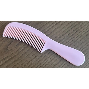 May include: A set of three ceramic mugs with a speckled, matte finish. The mugs are in shades of cream, light gray, and dark gray. Each mug has a simple, minimalist design, perfect for coffee or tea.