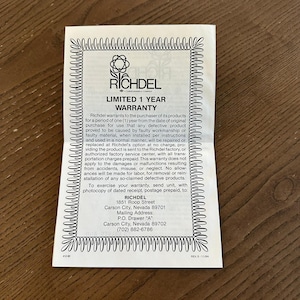 May include: A white paper document featuring a black decorative border and the Richdel logo at the top. The text outlines a limited 1-year warranty, including terms for repair or replacement, and provides the company address in Carson City, Nevada.