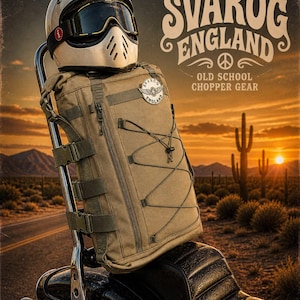 May include: A tan backpack and white motorcycle helmet with goggles are mounted on a motorcycle. The backpack has multiple straps and a bungee cord. The helmet is white with a black visor. The image includes the text "Svarog England Old School Chopper Gear".