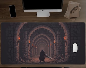 May include: A rectangular desk mat featuring a pixel art illustration of a dark, stone-walled dungeon corridor with arched ceilings and glowing orange torches. A lone figure in dark armor stands in the center holding a long sword.