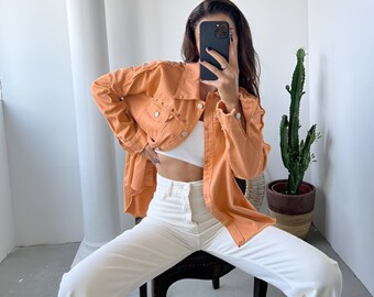 women's orange denim shirt jacket lightweight with stone detail on the pocket