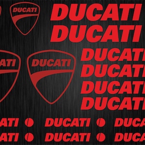 May include: A set of red Ducati motorcycle decals. The decals feature the Ducati logo in a variety of sizes and styles. The decals are perfect for adding a touch of Ducati style to your motorcycle, car, or other belongings.