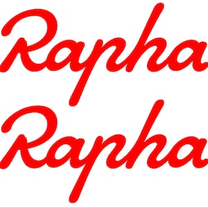 May include: Two instances of the word "Rapha" in a red, cursive font are displayed on a white background. The text is stylized with a flowing, handwritten appearance, suggesting a brand logo or design element.