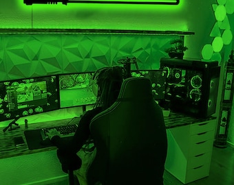 May include: A custom wall-mounted sign featuring the name GABRIEL in black lettering integrated with a lightsaber hilt and blade design. The sign emits a bright green glow from behind the letters and the lightsaber blade, creating a neon effect.