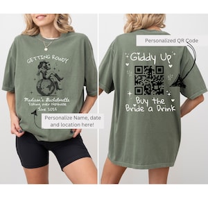 May include: Green t-shirt with a black and white illustration of a woman dancing on a disco ball. The text "Getting Rowdy" is above the illustration and "Madison's Bachelorette Taking over Nashville June 2025" is below. The back of the shirt has a black and white QR code with the text "Giddy Up" above and "Buy the Bride a Drink" below.