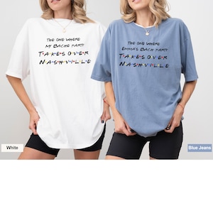 May include: Two women wearing oversized t-shirts with the text "The One Where My Bache Party Takes Over Nashville" and "The One Where Emma's Bach Party Takes Over Nashville". The shirts are white and blue. The women are wearing black shorts.