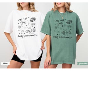 May include: Two oversized t-shirts with a graphic design featuring a cruise ship, a bow, and the text "Last Sail" and "Where the Vows". The text "Emily's Bachelorette" is also included on the shirts. The shirts are shown in white and light green.