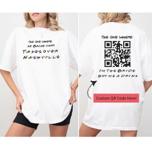 May include: White t-shirt with the text "The One Where My Bache Party Takes Over Nashville" on the front and a QR code with the text "I'm the Bride Buy Me a Drink" on the back. The text "Custom QR Code Here!" is below the QR code.