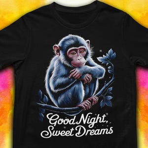 May include: A black t-shirt with a blue monkey illustration and the text "Good Night, Sweet Dreams".