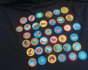 Collection of vintage embroidered Girl Scout merit badges.