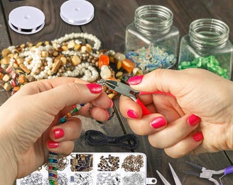 May include: A set of jewelry making supplies with a variety of beads, chains, and clasps. The set also includes two pairs of pliers and a spool of wire. The supplies are arranged in a clear plastic container with multiple compartments.