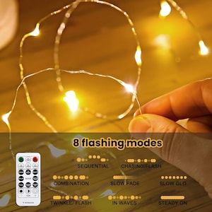 May include: Close-up of warm white LED string lights. The lights are on a thin, flexible wire. The image also shows a remote control with buttons for 8 flashing modes, including sequential, combination, and steady on.