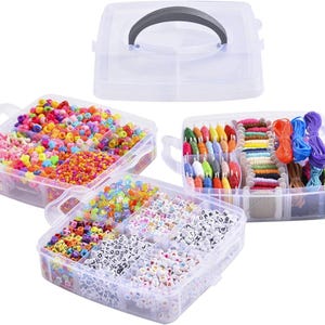 May include: Three clear plastic storage containers filled with colorful beads, letter beads, and embroidery floss. The containers are stacked on top of each other.
