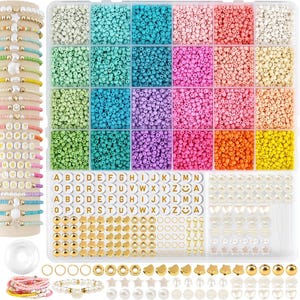 May include: A bead kit with a variety of colorful beads, letter beads, and charms. The kit includes a clear plastic organizer with compartments filled with beads in shades of white, blue, pink, green, and yellow. There are also bracelets with letter beads that spell out words.