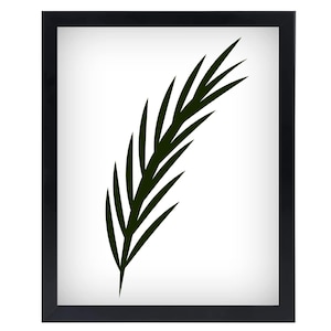 May include: A framed art print featuring a stylized, dark green leaf against a white background. The leaf has a feather-like appearance with long, pointed segments. The frame is black, creating a modern, minimalist aesthetic. This botanical print is suitable for home decor.