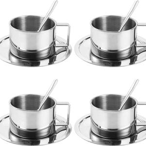 May include: Set of four stainless steel coffee cups with matching saucers and spoons. Each cup has a simple, modern design.