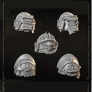 May include: A collection of grey shoulder pads with various designs, including crosses, chains, and intricate detailing. The shoulder pads are likely for a miniature figure or model, with a focus on fantasy or sci-fi themes.