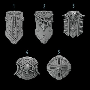 May include: Five different styles of round and shield-shaped Viking-themed metal shields. The shields are decorated with runes, animal skulls, and other Viking symbols.