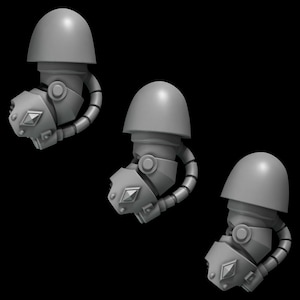 May include: Three gray plastic robot arms with a rounded helmet on top. Each arm has a pipe-like extension and a diamond-shaped detail on the front.