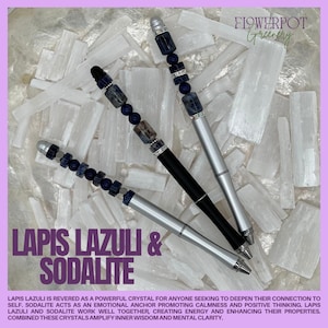 May include: Three pens with silver and black barrels, decorated with lapis lazuli and sodalite beads. The pens are displayed on a bed of white crystals. The image includes the text "LAPIS LAZULI & SODALITE" and "FLOWERPOT Greenery".