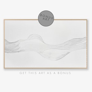 May include: Abstract art print with a white background and black lines forming a wave-like pattern. The print is framed in a light wood frame. The text "BONUS ART" is in a circle at the top of the image. The text "GET THIS ART AS A BONUS" is at the bottom of the image.