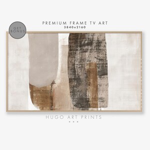 Könnte beinhalten: Abstrakter Kunstdruck mit braunen, beigefarbenen und grauen Formen auf weißem Hintergrund. Der Druck ist in einem hellen Holzrahmen gerahmt. Der Text "HUGO ART PRINTS" befindet sich am unteren Rand des Drucks.