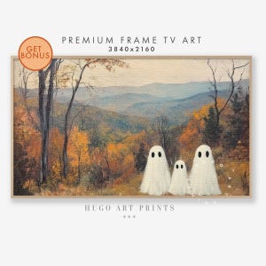 May include: A framed landscape painting featuring a forest scene in autumn and three white ghost figures. The artwork has a light brown frame and the text "PREMIUM FRAME TV ART" and "HUGO ART PRINTS".