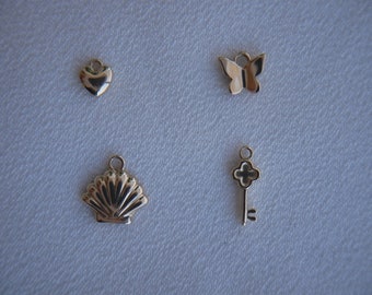 Encantos de oro sólido de 14k: corazón, mariposa, concha, llave de trébol
