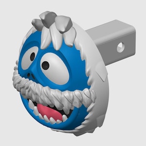 May include: A blue and white snowman hitch cover with a wide grin and a white mustache. The hitch cover is attached to a silver hitch.