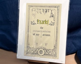 May include: A rectangular art print on cream paper with a black decorative border. The text reads Hark! the consequences of my actions. Above the text are illustrations of pointing hands, and below are two small figures. The print is in a clear sleeve.