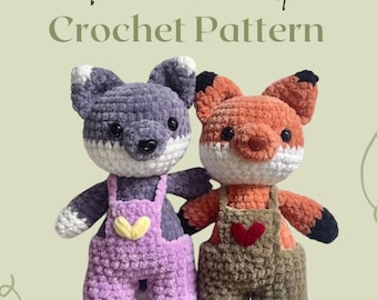 May include: Crochet pattern for a fox and wolf amigurumi. The fox is orange and brown with a white belly and a heart-shaped patch on its overalls. The wolf is gray with a white belly and a yellow heart-shaped patch on its overalls. Both are wearing purple and brown overalls.