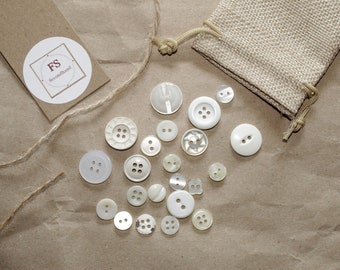 22 different white/beige buttons, craft and sewing supplies