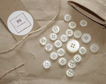 22 blouse buttons transparent/white four-hole button