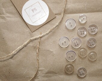 12 transparent buttons, craft and sewing material