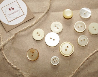 11 jacket buttons, transparent/beige, GDR sewing material