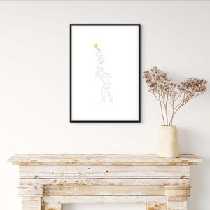 May include: A black framed print of a line drawing of two people playing a game of basketball. The print is hanging on a white wall above a wooden mantel.