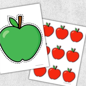 May include: Two sheets of paper with apple illustrations. One sheet features a large green apple with a brown stem and green leaf. The other sheet has multiple red apple illustrations with green leaves and brown stems.
