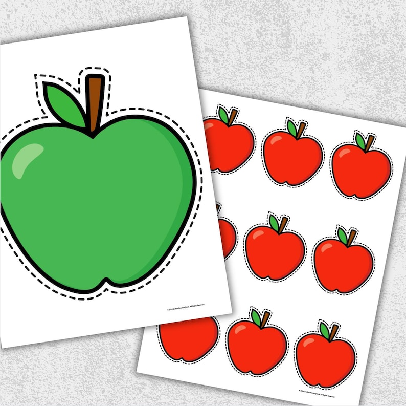 May include: Two sheets of paper with apple illustrations. One sheet features a large green apple with a brown stem and green leaf. The other sheet has multiple red apple illustrations with green leaves and brown stems.