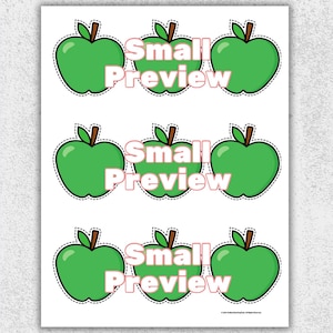 May include: A sheet of stickers featuring green apple designs with brown stems and leaves. The text "Small Preview" is printed in pink across the center of each apple. The stickers are outlined with a dashed black line.