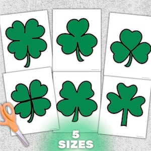 May include: Six white paper sheets featuring green shamrock designs, each with a black outline. The text "5 SIZES" is printed in green at the bottom. A pair of orange scissors is in the lower left corner.