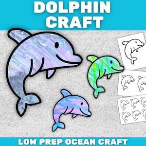 May include: Dolphin craft project with three colorful dolphin cutouts and several black and white dolphin outlines. The text "DOLPHIN CRAFT" and "LOW PREP OCEAN CRAFT" are displayed in the image.