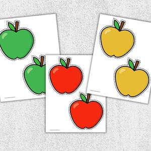 May include: Several white cards with apple illustrations. The apples are in green, red, and yellow, each with a green leaf and brown stem. The apple outlines are black with a dashed line.