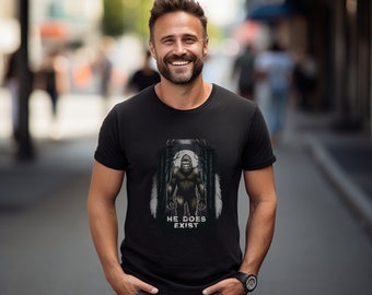 Bigfoot Believer Shirt - 'He Does Exist' Graphic Tee - Casual Wear for Cryptozoology Fans - Unique Gift for Him