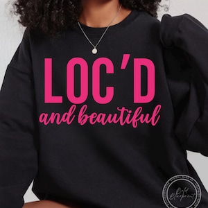 May include: Black sweatshirt with the text "LOC'D and beautiful" in pink lettering.