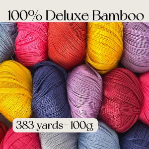 May include: A collection of 100% Deluxe Bamboo yarn skeins in various vibrant colors including pink, red, yellow, purple, blue, and gray. The text 100% Deluxe Bamboo and 383 yards- 100g is printed on the image, indicating the material and weight.