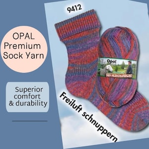 May include: A pair of colorful striped socks and a matching ball of Opal Premium Sock Yarn. The yarn and socks feature shades of red, purple, and blue. The image includes text that reads "Superior comfort & durability."