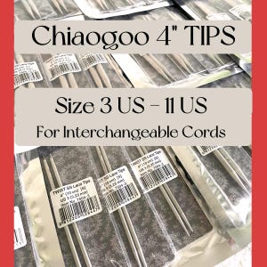May include: A close-up of a set of silver interchangeable knitting needles, labeled "Chiaogoo 4" TIPS Size 3 US - 11 US For Interchangeable Cords". The needles are packaged individually and labeled with the size and item number.